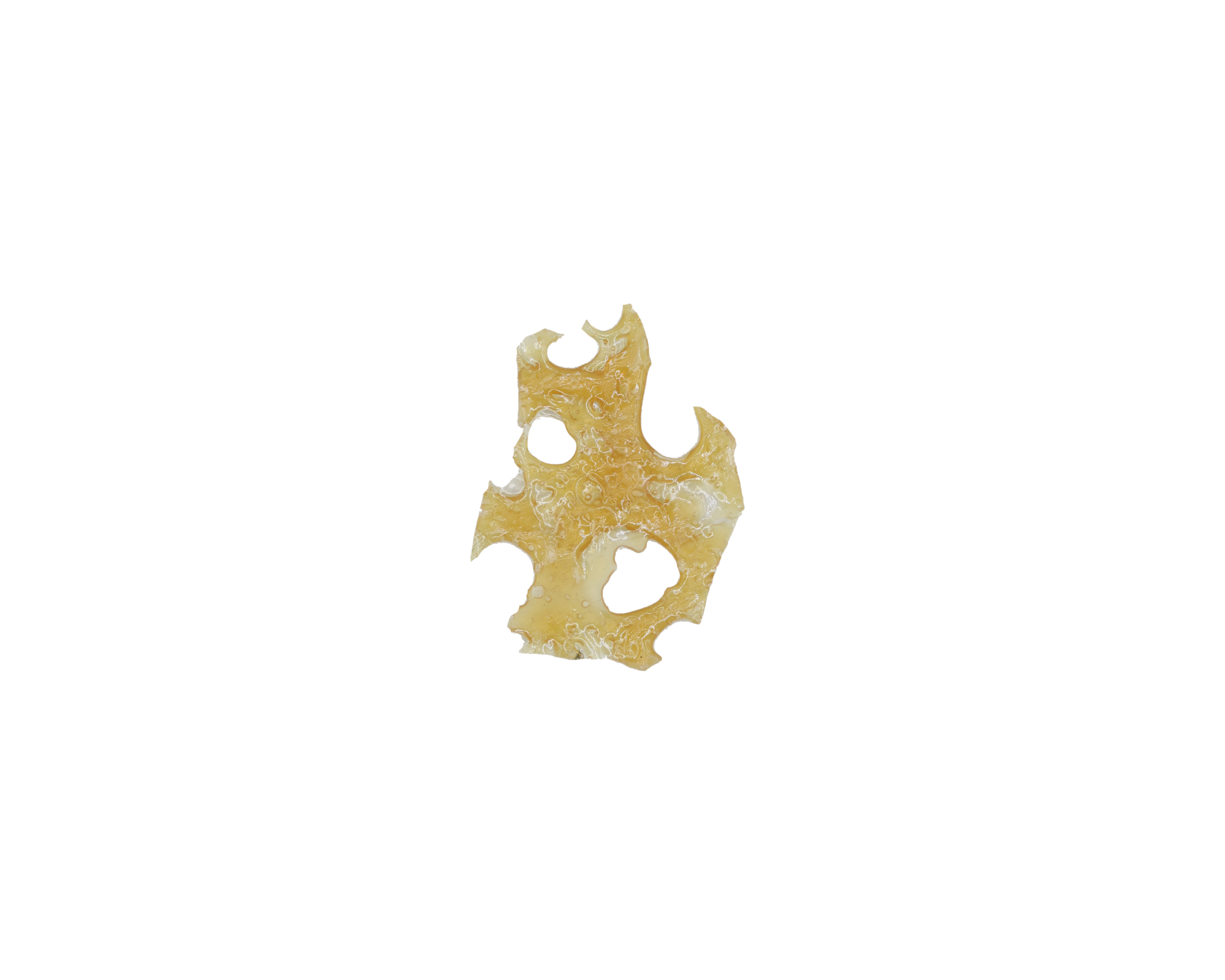 A hard, glassy slab of cannabis shatter, shown for comparison with diamond crystals